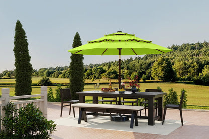 Outdoor dining set with a green umbrella on a patio