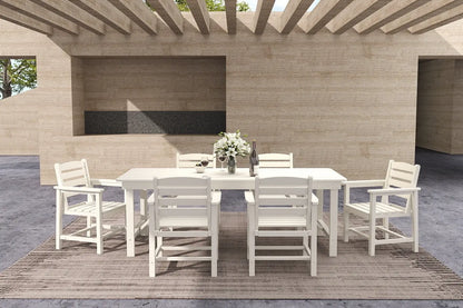 Outdoor dining set with a table and chairs on a wooden deck.