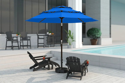 Blue patio umbrella with black base on a patio near a pool