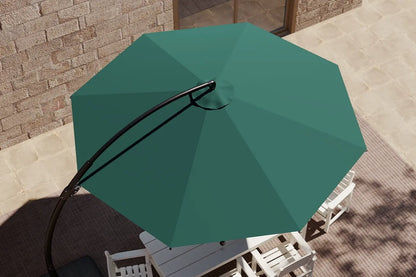 Green patio umbrella on a table with a stone wall background