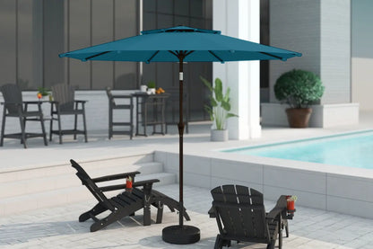 Blue patio umbrella on a stand in an outdoor setting with chairs and a pool.