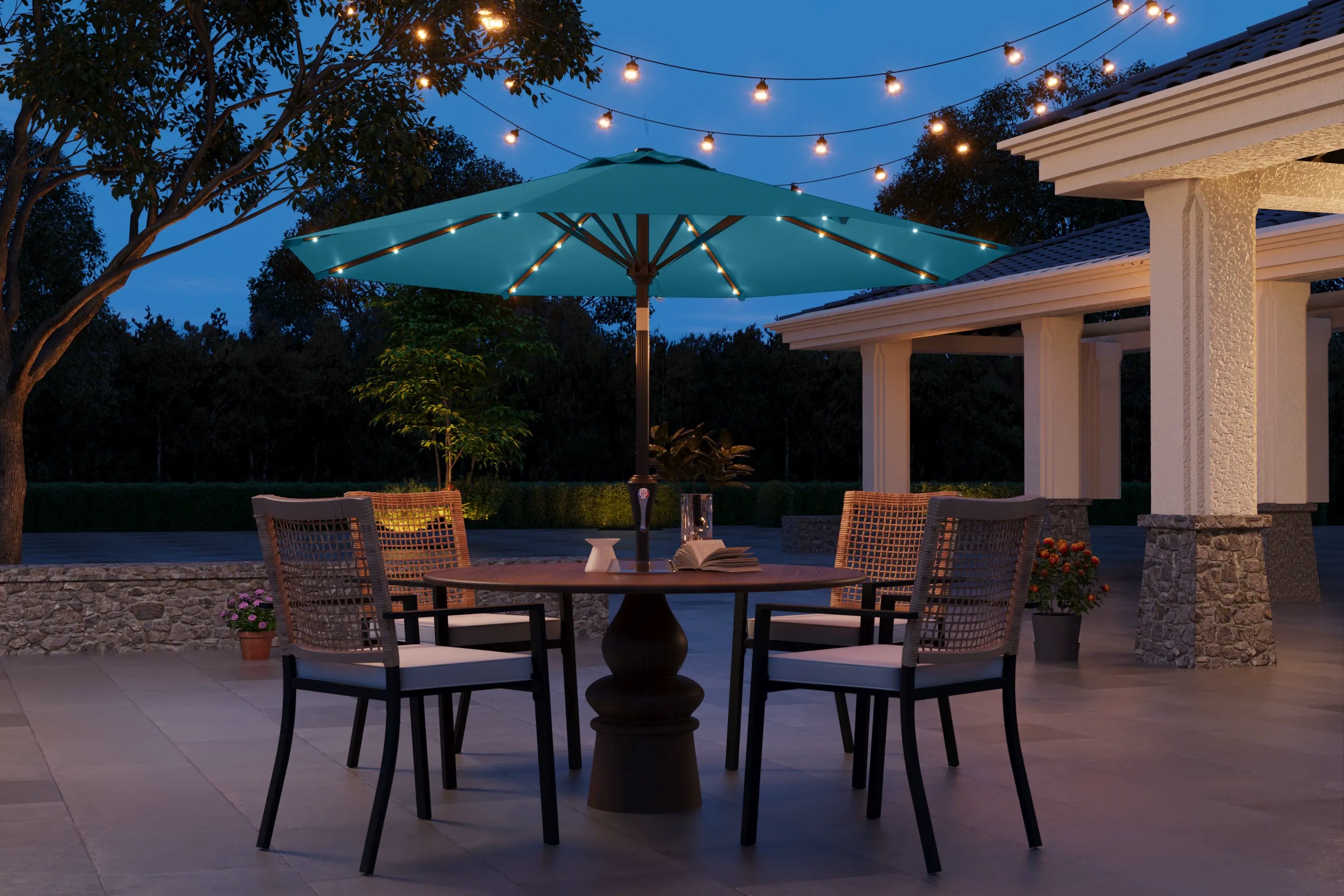 Outdoor patio setting with a table, chairs, and string lights at dusk.