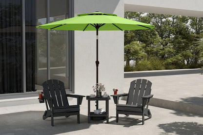 Outdoor patio set with black chairs and a green umbrella on a patio.