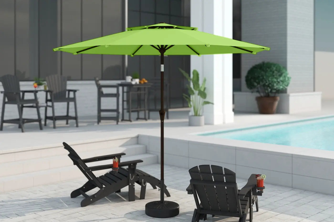 Green patio umbrella on a stand in an outdoor setting with chairs and a pool.