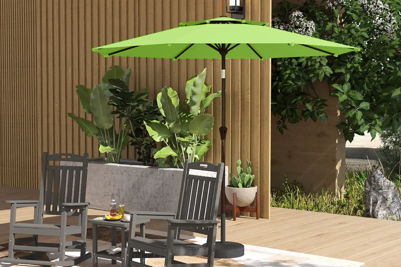 Green patio umbrella over outdoor furniture with plants and a wooden wall in the background