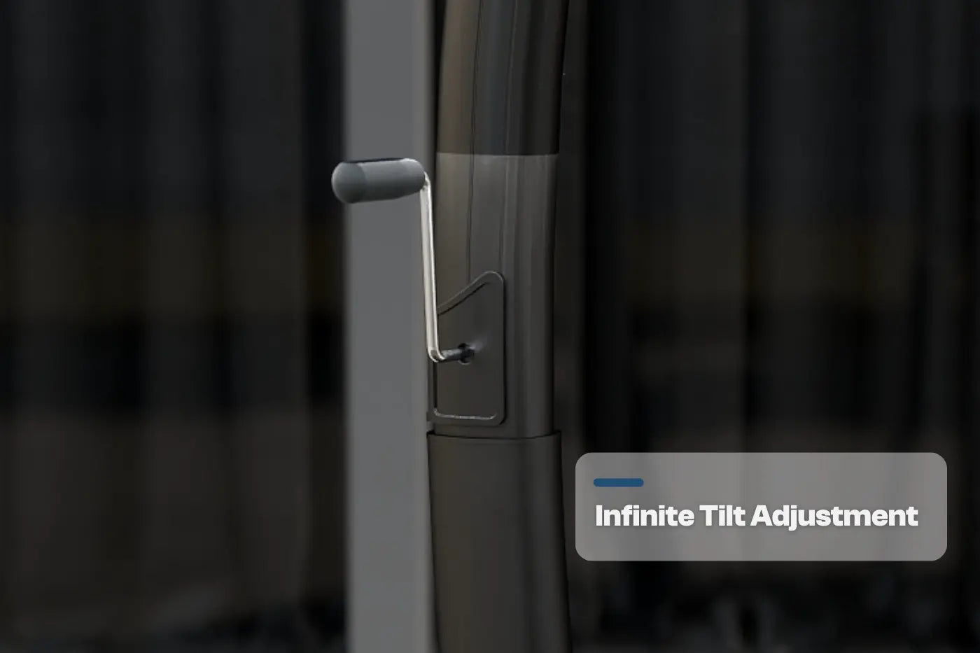 Close-up of a door handle with 'Infinite Tilt Adjustment' text on a blurred background