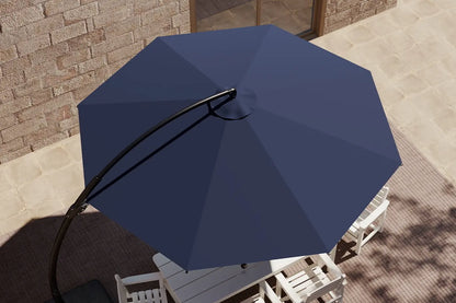 Blue patio umbrella on a stand with a brick wall and table in the background