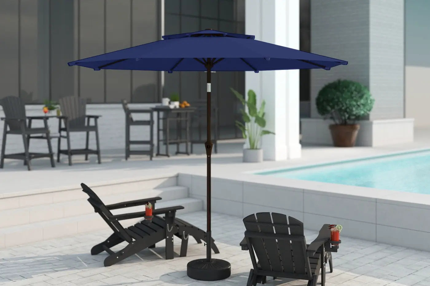 Blue patio umbrella on a stand in an outdoor setting with chairs and a pool.