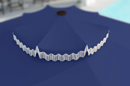 Blue umbrella with white trim on a plain background