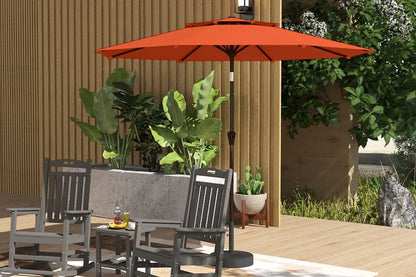 Patio set with orange umbrella, chairs, and table on a wooden deck.