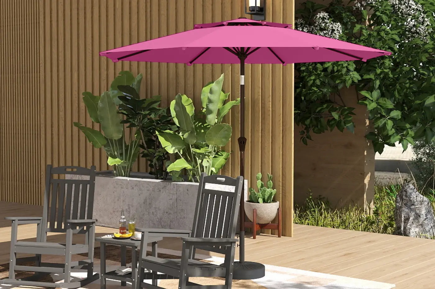 Patio set with pink umbrella, chairs, and table in a garden setting