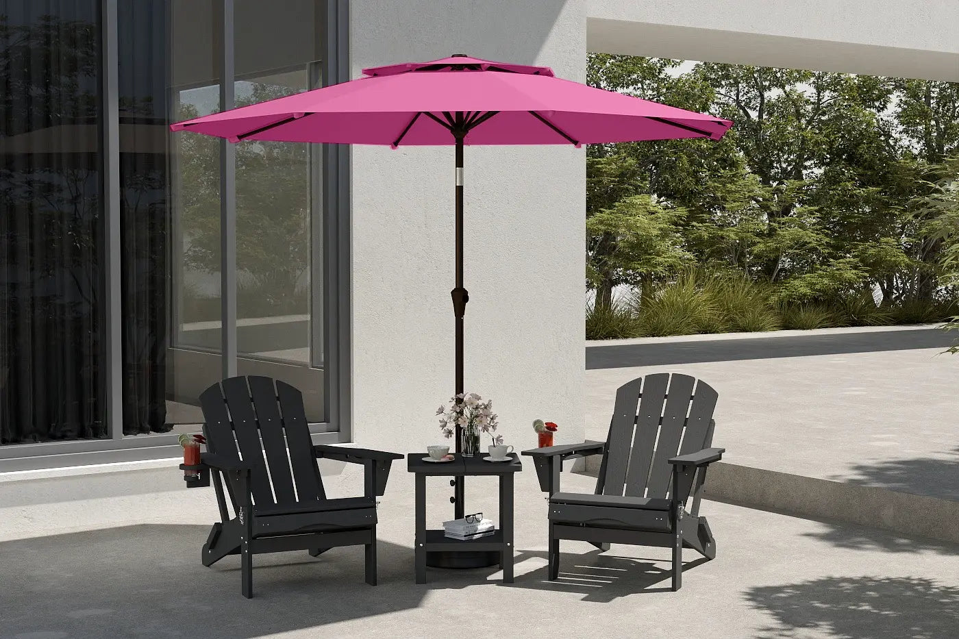 Outdoor patio set with black chairs and a pink umbrella on a patio.