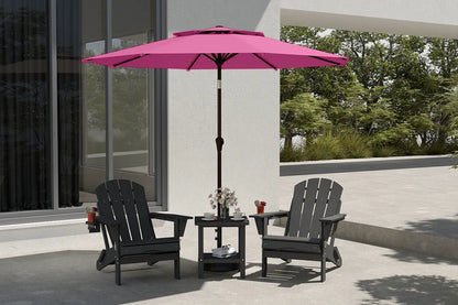 Outdoor patio set with black chairs and a pink umbrella on a patio.