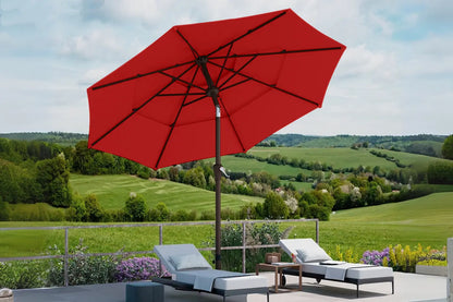 Red patio umbrella over outdoor furniture with a scenic background