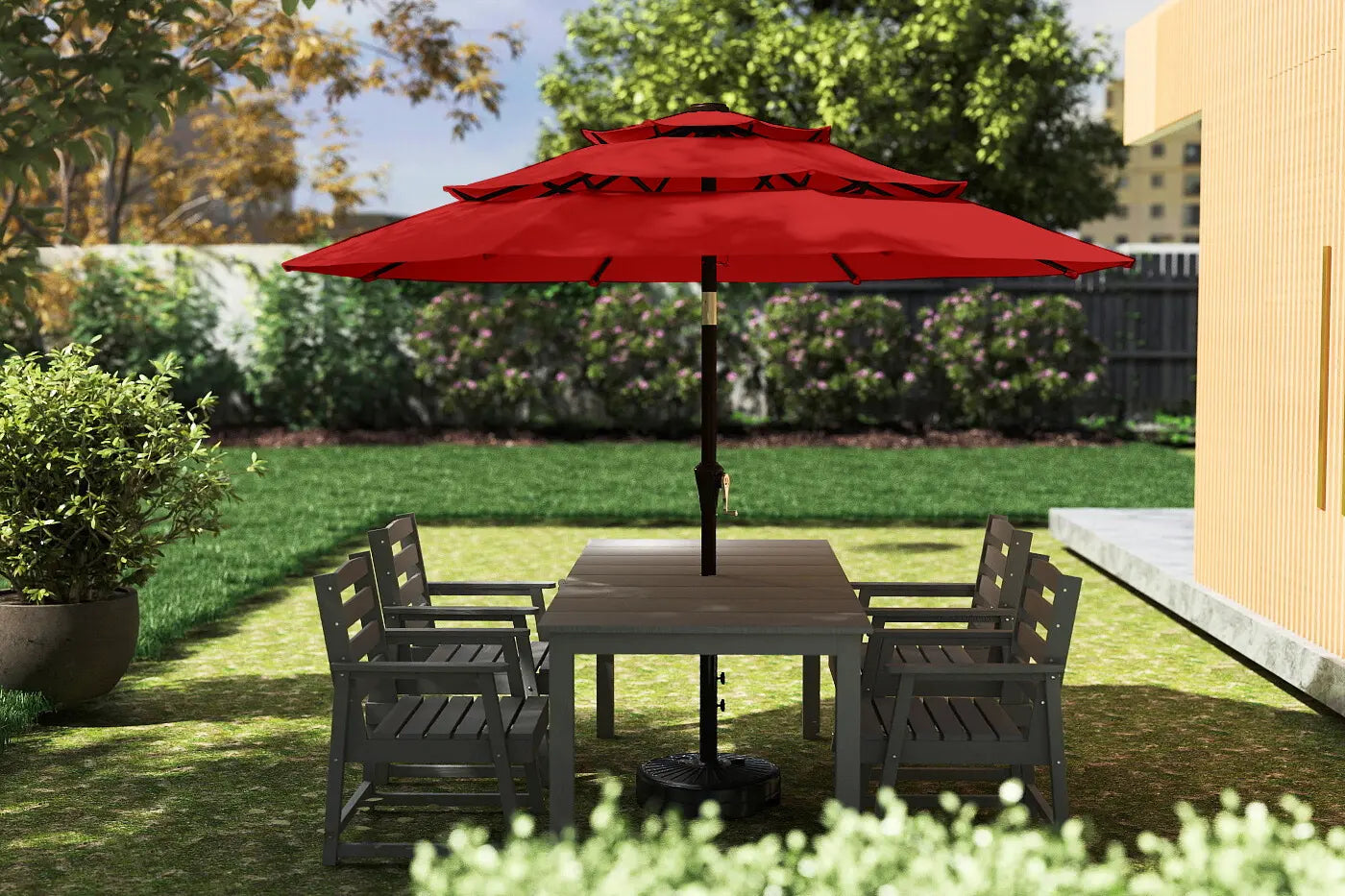 Outdoor patio set with a red umbrella in a garden setting