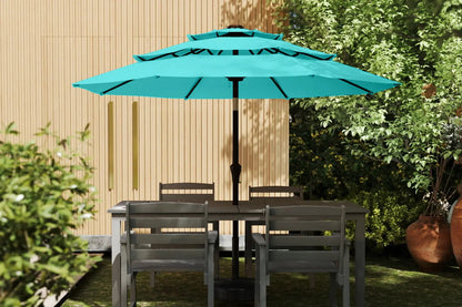 Turquoise patio umbrella over a dining table with chairs in a garden setting.