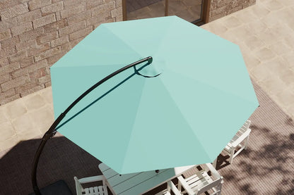 Turquoise patio umbrella on a table with a brick wall background
