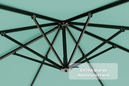 Close-up of an umbrella's black aluminum frame against a teal background with 'Extra Sturdy Aluminum Frame' text.