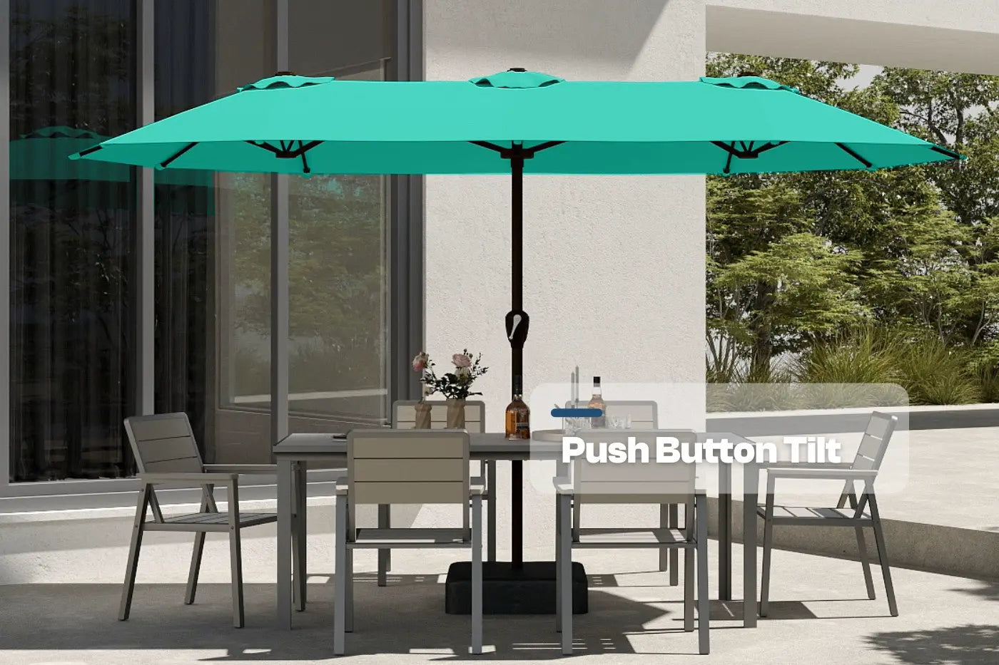 Turquoise patio umbrella with push-button tilt feature over a dining table set on a patio.