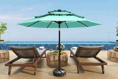 Turquoise patio umbrella with two lounge chairs and a small table on a sunny day.