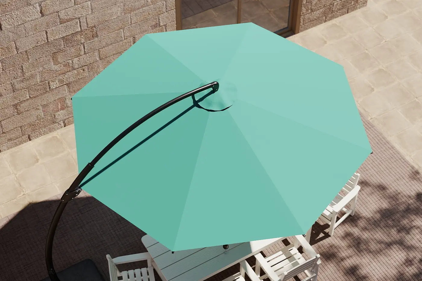 Turquoise patio umbrella on a table with a stone wall background