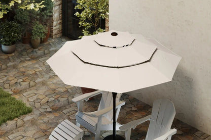 White patio umbrella on a stand with chairs underneath in an outdoor setting.