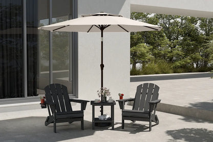 Outdoor patio set with two black chairs and a table under a beige umbrella on a patio.