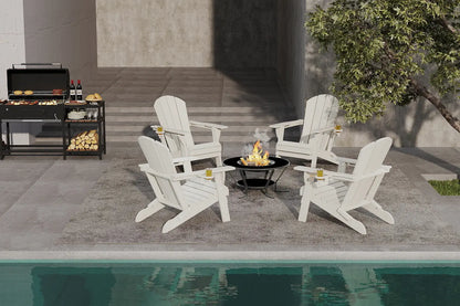 White Adirondack chairs around a fire pit on a patio by a pool