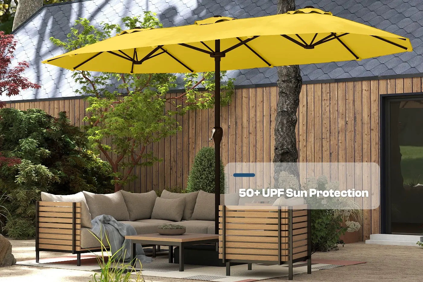 Yellow patio umbrella providing 50+ UPF sun protection over outdoor furniture.