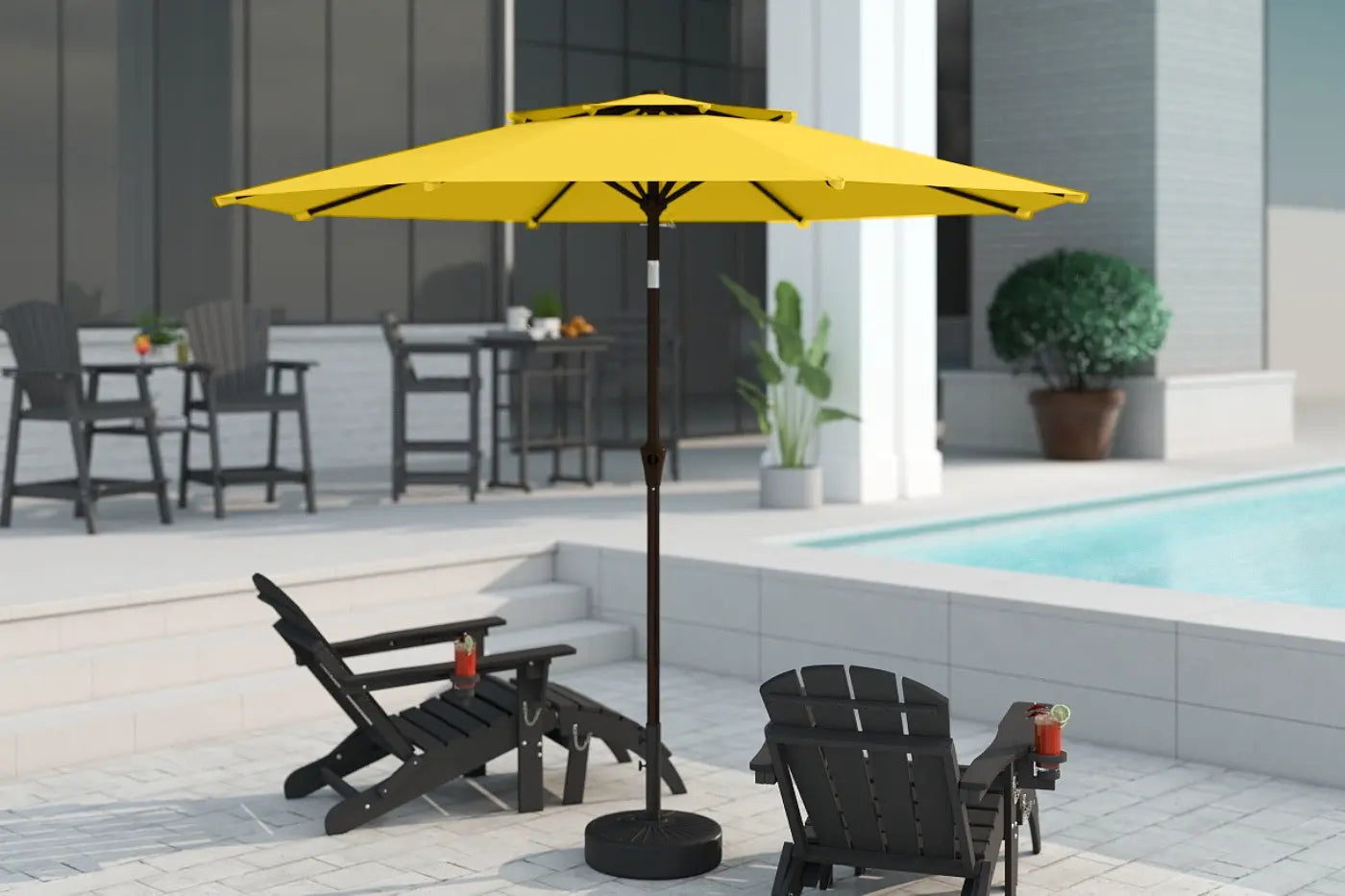 Yellow patio umbrella on a stand in front of a poolside area with chairs and tables.