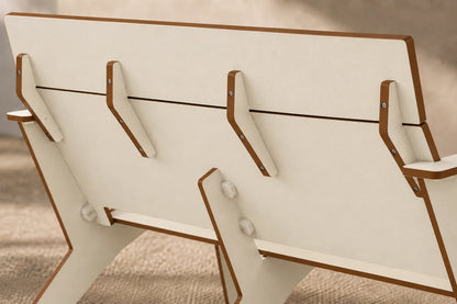 Close-up of a beige chair backrest showing the slatted seat, support brackets, and side armrests.