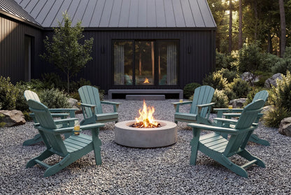 Outdoor setting with  Adirondack chairs around a fire pit in front of a house.