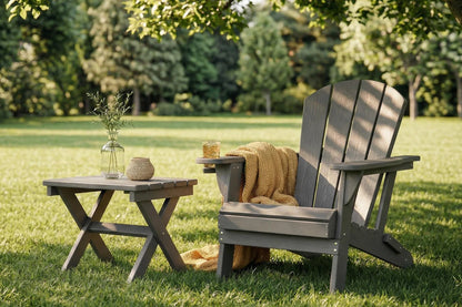 Outdoor setting with a wooden chair and table on grass