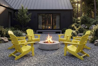 Yellow Adirondack chairs around a fire pit in front of a cabin.
