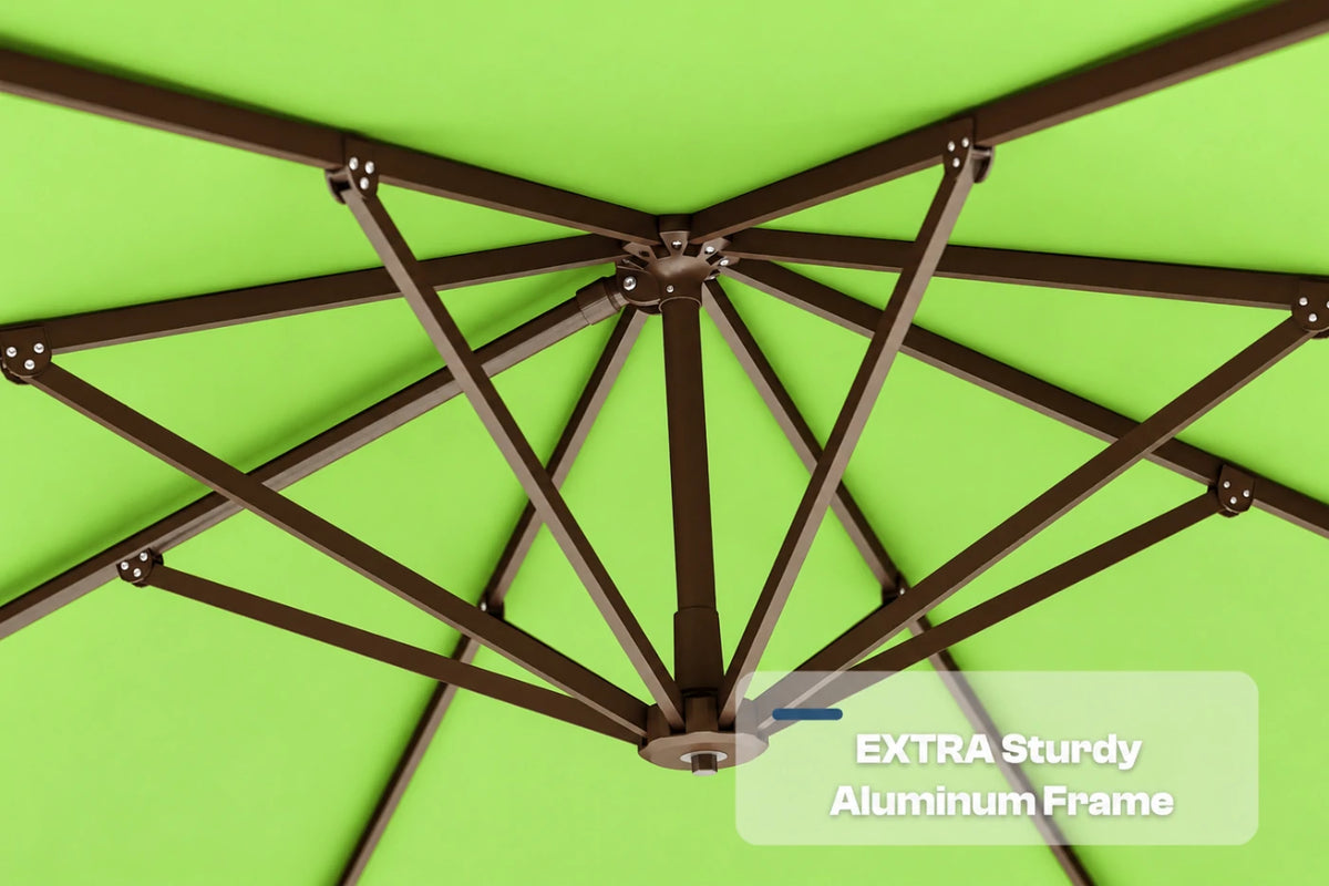 Close-up underside view of an apple green patio umbrella showing the dark aluminum canopy frame structure, with a text overlay that reads 'EXTRA Sturdy Aluminum Frame'.