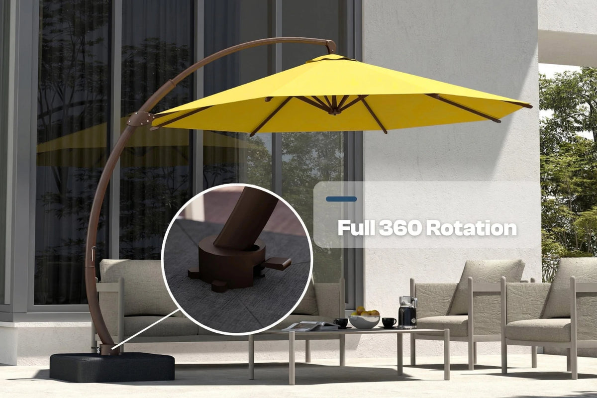 Yellow outdoor patio umbrella with a curved brown metal frame and black weighted base, shown beside patio seating with a circular inset highlighting the base and text reading 'Full 360 Rotation'.
