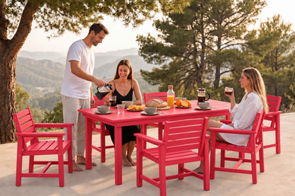 A red outdoor dining set with a rectangular table and 6 matching chairs, shown in use by three people on a patio with a scenic mountain background at sunset.