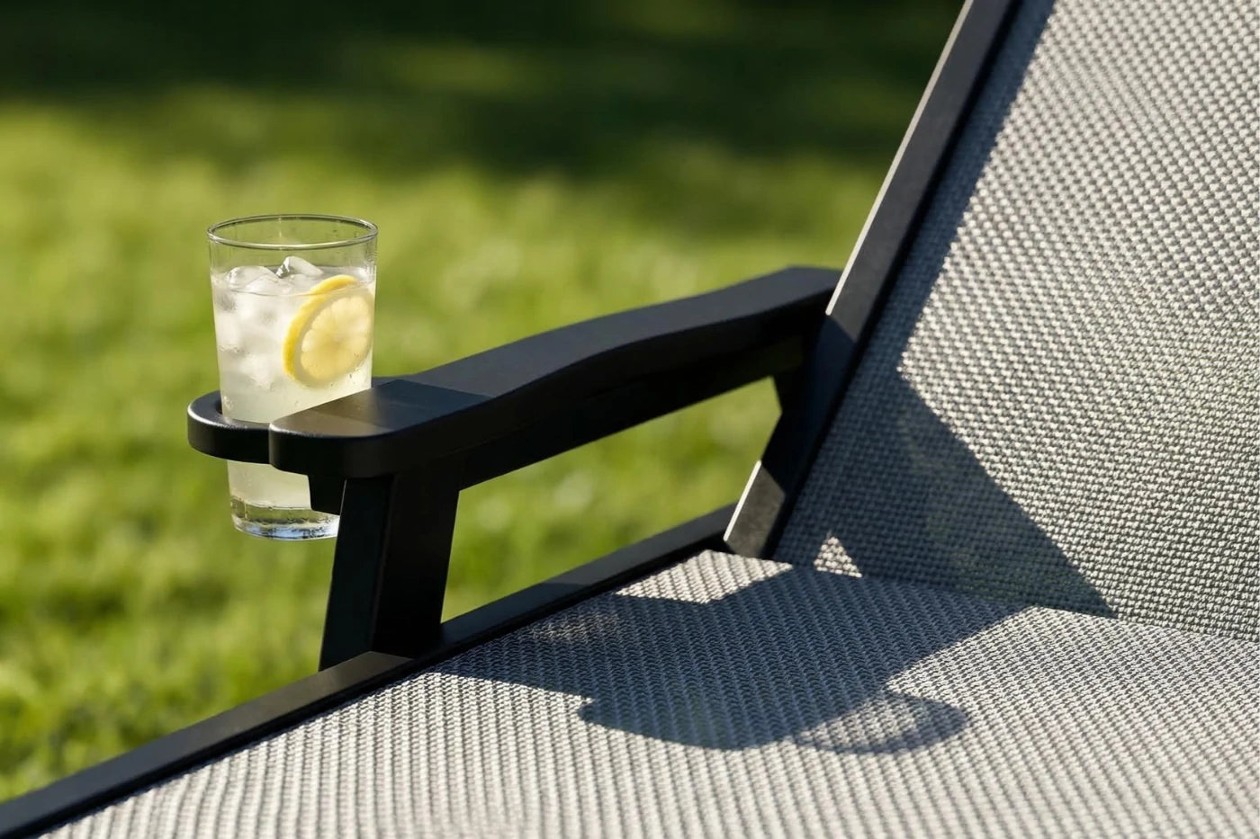 Dark gray HDPE Outdoor Chaise Lounge with Textilene Fabric keeps drinks close