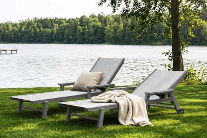 Gray HDPE Outdoor Chaise Lounge with Textilene Fabric by the lake