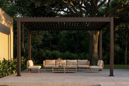 Outdoor patio with pergola, sofa set, and chairs in a garden setting