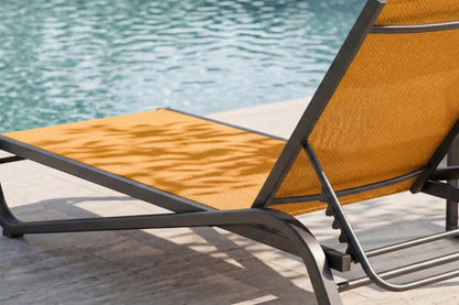 Orange lounge chair by a pool