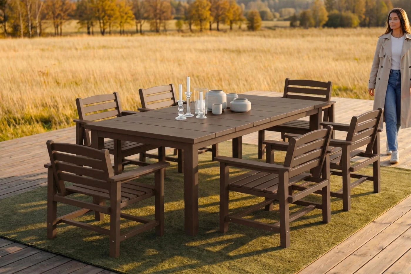 HDPE outdoor dining set with chairs on a deck overlooking a field.