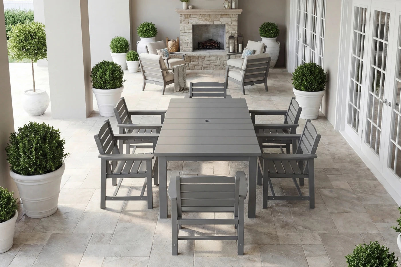 Outdoor patio set with table and chairs on a tiled patio, surrounded by potted plants.