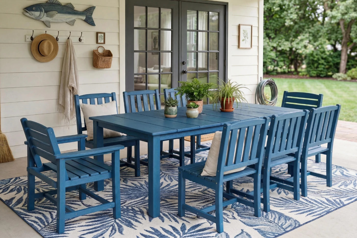 Blue outdoor dining set with chairs and table on a patio