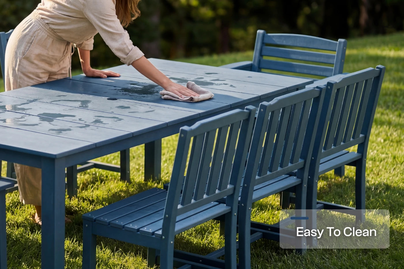 Person cleaning a blue outdoor table and chairs with 'Easy To Clean' text overlay.
