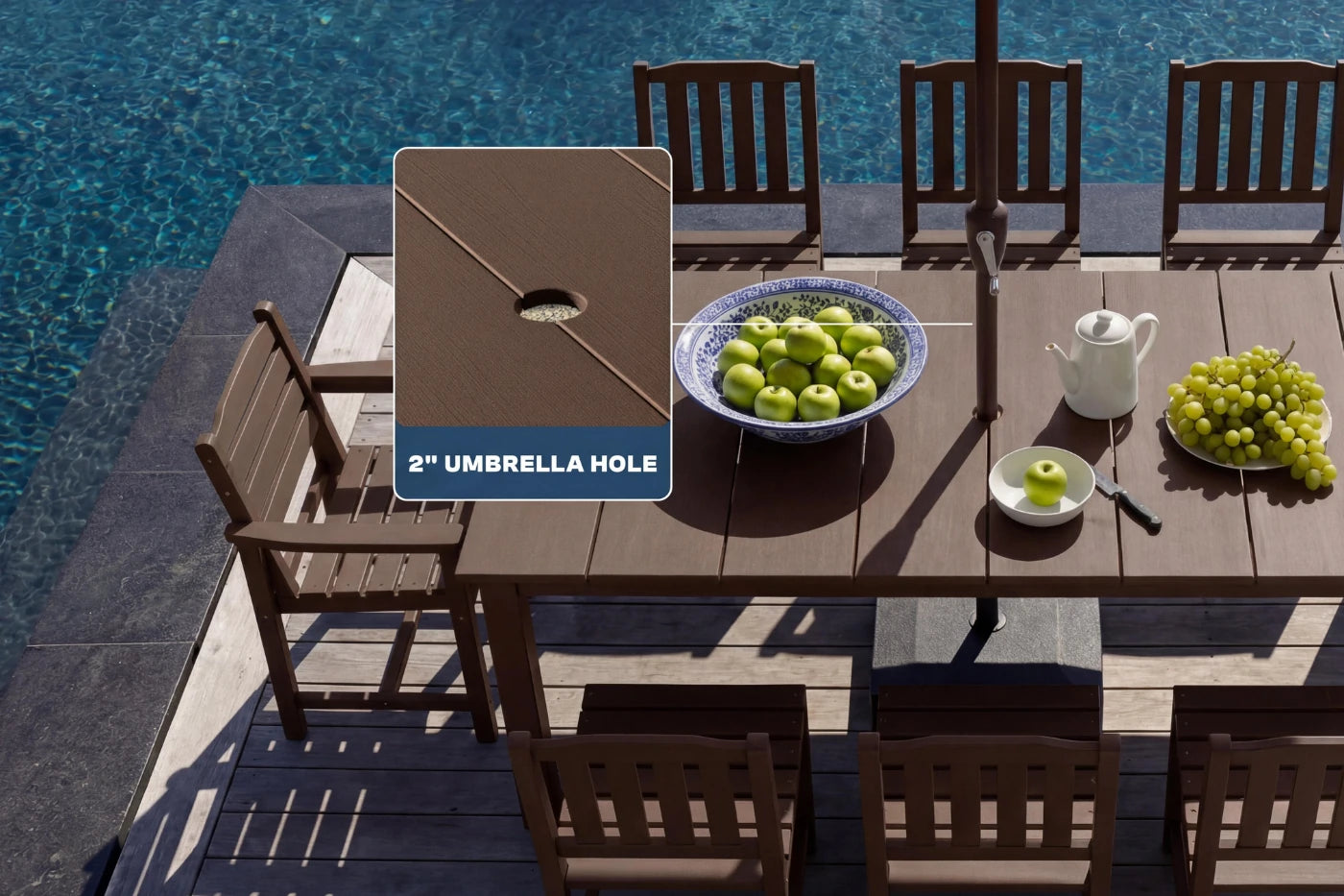 Outdoor dining set with table and chairs by a pool, featuring an umbrella hole.