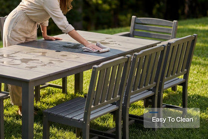 Person cleaning an outdoor table and chairs on a grassy area with 'Easy To Clean' text overlay.