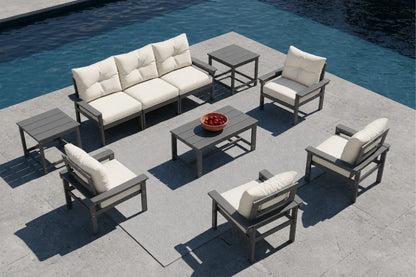 Outdoor patio furniture set with beige cushions by a pool