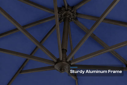 Close-up underside view of a patio umbrella showing a dark aluminum frame structure against a navy blue canopy background, with the text 'Sturdy Aluminum Frame' in the lower right corner.