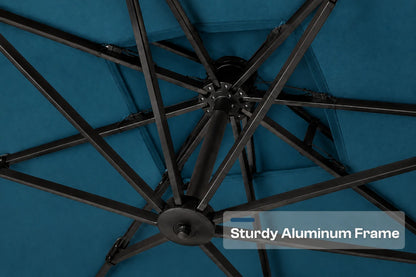 Close-up of the underside of a patio umbrella showing a dark aluminum frame with radiating ribs over a lake blue fabric canopy. A text overlay reads 'Sturdy Aluminum Frame'.